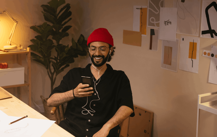 man at desk with phone