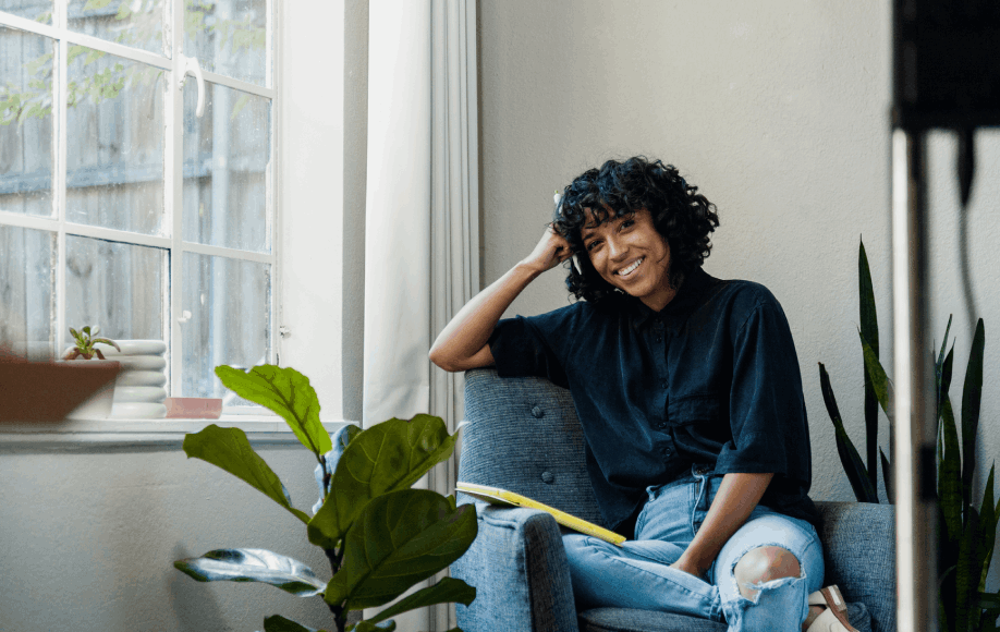 smiling woman in comfy chair